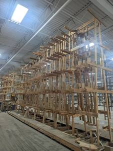 lot 70 image: HUGE Custom Wood Racking System  32 Long x 7 Wide x 16 Tall This kind of storage setup doesnt come around often. Built like a tank for trim, lumber, or custom materials. Tons of space  perfect for pros who need next-level organization.