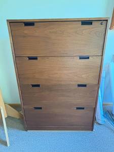 lot 72 image: Classic 4.5ft Wood Hutch  Timeless Look, Functional Storage Sturdy and spacious with a warm wood finish. A great piece for organizing files, books, or decor in any office or workspace.          Ask ChatGPT