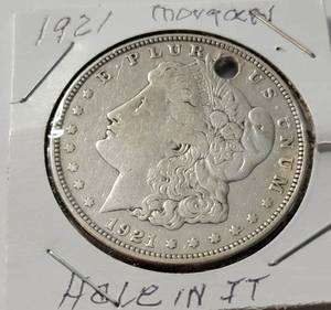 lot 57 image: 1921 Morgan Silver Dollar with Hole in it.