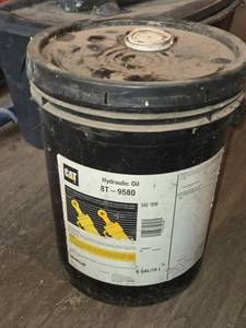 lot 53 image: CAT SAE 10W 5 Gallon Hydraulic Oil 8T-9580
