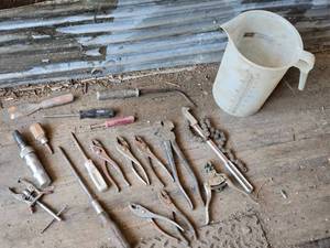lot 83 image: Various Hand Tools such as pliers, screwdrivers, chain wrench, and a measuring jug