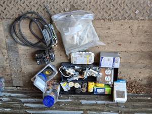 lot 94 image: Lot of Electrical Components and Supplies such as outlets, switches, plugs, connectors, and circuit breakers