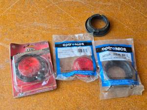 lot 218 image: Semi Trailer Lights, Grommets featuring Optronics 4 round tail lights and grommets