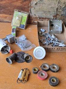 lot 247 image: Electrical Supplies including Leviton PR150 Motion Activated Light Control, EMT 12 Screw Couplings, and Assorted Electrical Hardware