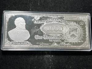 lot 76 image: 4 TROY OZ .999 FINE SILVER $1000 BILL DESIGN IN AIRTITE