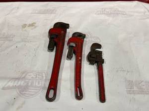 lot 324 image: Three Red Pipe Wrenches in Various Sizes