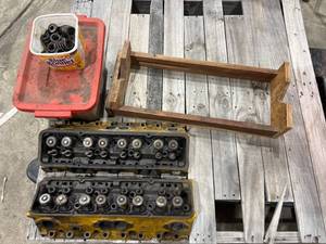 lot 118 image: GM Engine Cylinder Heads with Bolts and Wooden Stand