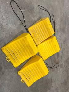 lot 740 image: Four Yellow Plastic Wheel Chocks with Attached Ropes