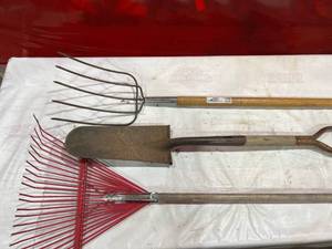 lot 214 image: Three Garden Tools Including Rake, Shovel, and Pitchfork