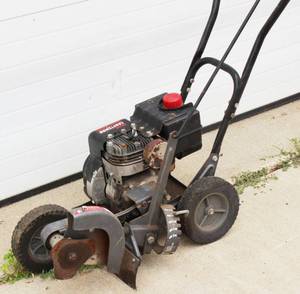 lot 15 image: Edger  Trimmer Craftsman 3.5 HP Gas Operated