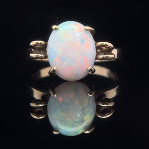 lot 37 image: Oval White Opal Cabochon Solitaire Vintage Ring in Yellow Gold VIDEO