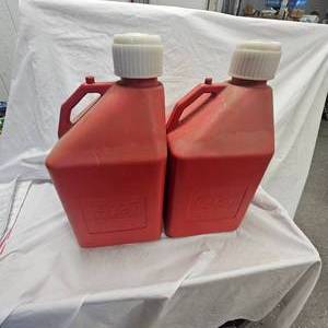 lot 184 image: 2-5 Gallon Racing Style Gas Jugs, like new