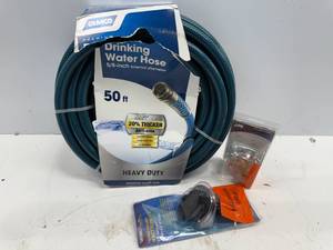 lot 122 image: CAMCO DRINKING WATER HOSE AND ACCESORIES.