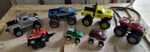 lot 32 image: Group of big tire mud trucks