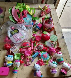 lot 34 image: Lot of Hello Kitty, small characters, water slide, trike, even a remote control car