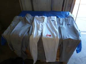 lot 50 image: 6 pair of baseball pants, 2 pr cleats