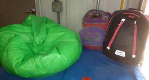 lot 90 image: Kids beanbag chair, backpack with a indoor tent and backpack with a sleeping bag