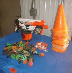 lot 93 image: Kids mega nerf gun that shoots disks and a pile of cones for your RC cars or whatever