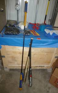 lot 96 image: 2 Baseball bats, baseball swing trainer, protective gear, rocket, plastic baseballs