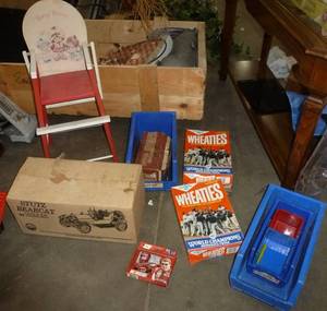 lot 115 image: Whats left - tool bins, twins wheaties boxes, doll high chair, Jim Beam bottle and a grinder