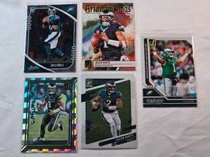 lot 90 image: Lot of 5 Jalen Hurts Cards Including Absolute Rookie Card, Gridiron Kings, Best of Panini Instant, Dominators