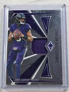 lot 264 image: Lamar Jackson 2024 Panini Phoenix Franchise Future Materials Relic #FFM-LJN and Numbered 123299 - Baltimore Ravens Football Card