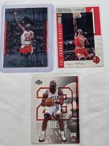 lot 311 image: Lot of 3 Michael Jordan Basketball Cards Including The Jordan Dynasty and Athlete of the Century