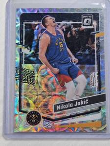 lot 319 image: Nikola Jokic 2023-24 Panini Donruss Optic Silver Prizm #19 and Numbered 51249 - Denver Nuggets Basketball Card