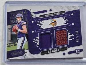 lot 462 image: J.J. McCarthy Dual Relic Rookie 2024 Panini Absolute Tools of the Trade #TOTD-JMY and Numbered 7349 - Minnesota Vikings Football Card