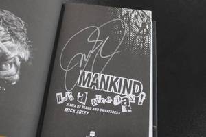 lot 83 image: Mankind Have a Nice Day Book w Mankind Autograph