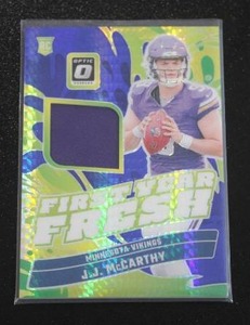 lot 126 image: 2024 Optic First Years Fresh Hyper Prizm JJ McCarthey Jersey Relic Rookie Card