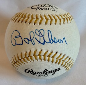 lot 10B image: Bob Gibson Signed Baseball with PSADNA COA Rawlings Official Gold Glove Ball - St. Louis Cardinals