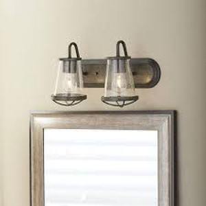 lot 53 image: Home Decorators Collection Georgina 18 in. 2-Light Weathered Iron Industrial Rustic Vanity with Clear Seeded Glass Shades and Cage Accents Customer Returns See Pictures