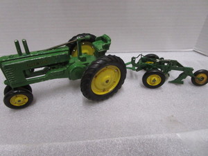 lot 23 image: John Deere B Toy Tractor, Metal 2 Bottom Plow
