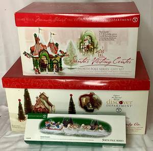 lot 168 image: Department 56 North Pole Series Gift Set Sweet Rock Candy CO. and Santas Visiting Center with Canine Couriers