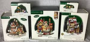 lot 174 image: Department 56 North Pole Series Flurrys Snowglobe Maker, Jack In the Box Plant No. 2, North Pole M & Ms Candy Factory plus M & Ms Stamp of Approval and Fillers and Flakers