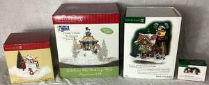 lot 172 image: North Pole Series Department 56 Frostys Sleds N Saucers, Mickeys North Pole Holiday House, Mickey Builds a Snowman and Kringle Street Snowman