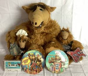 lot 283 image: Vintage Alf Collection - Contains one 1987 Alien Productions Talking Alf with Cassette (Missing Battery Cover) and  2 Burger King Many Faces of Alf Record and Puppet Sets