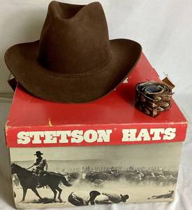 lot 19 image: Brown Stetson 5X Beaver Felt Fur Cowboy Hat Size 7 38 with Feather Hat Band (Comes with Original Box) - small holesimperfections on one side from pins placed on hat