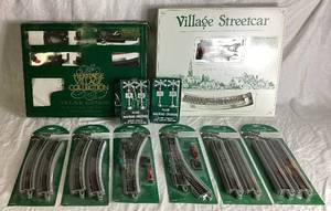 lot 316 image: Dept 56 Village Accessories - Village Streetcar, Heritage Village Express Tain Set, Straight and Curved Track Sets, and 2 Railroad Crossings