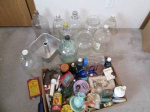 lot 84 image: A large collection of glass jugs, t...