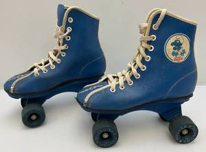 lot 181 image: Vintage Roller Derby Brand Kids SMURFS Roller Skates (Missing Front Rubber Stops)