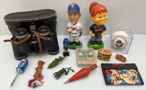 lot 214 image: Misc. Vintage Sports Collectibles Including Minnesota Twins Bobble Heads, Old Rubber Frog Lures, Guatamalan Trouble Dolls & More