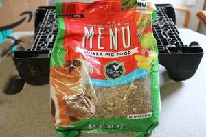 lot 64 image: 4 lb bag of Guinea pig food...