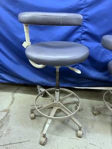 lot 7 image: MSRP $1200 A-Dec 1622 Dental Assistant Chair Stool with Foot Ring - Adjustable Positioning for Enhanced Comfort - Great Condition - A Couple Flaws To Upholstery On The Arm Support - See Pics