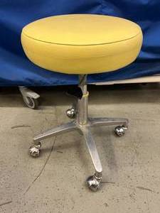 lot 13 image: Dental Stool Chair with Pneumatic Height Adjustment - Super Fun Yell Seat Color However Adjustable Height Lever Not Working  I hated to see this go in the trash...someone fix it
