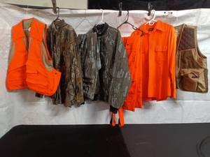 lot 25 image: Collection of Hunting Apparel including Vests, Jacket, and Shirts
