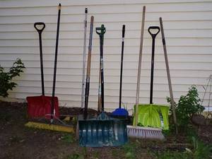 lot 75 image: Collection of Snow Shovels, Rakes, and Brooms