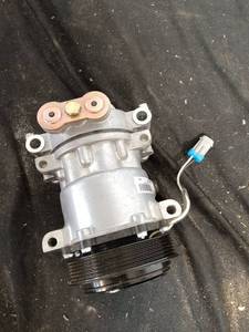 lot 86 image: Brand New AC Compressor for Chevy