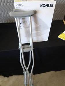 lot 41 image: KOHLER TOILET SEAT COVER  NEW CRUTCHES